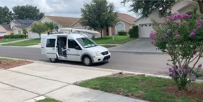 Service van parked outside a home on a residential street