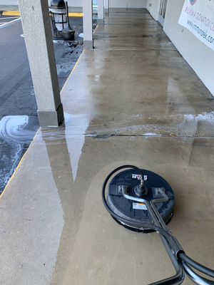 Freshly pressure-washed patio walkway with the surface cleaner