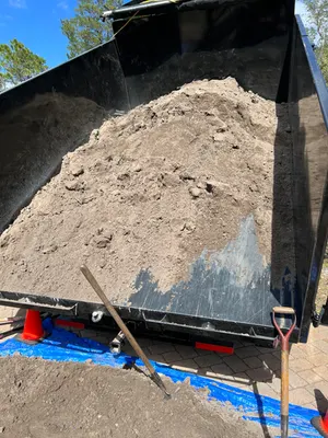Dump trailer loaded with fill soil